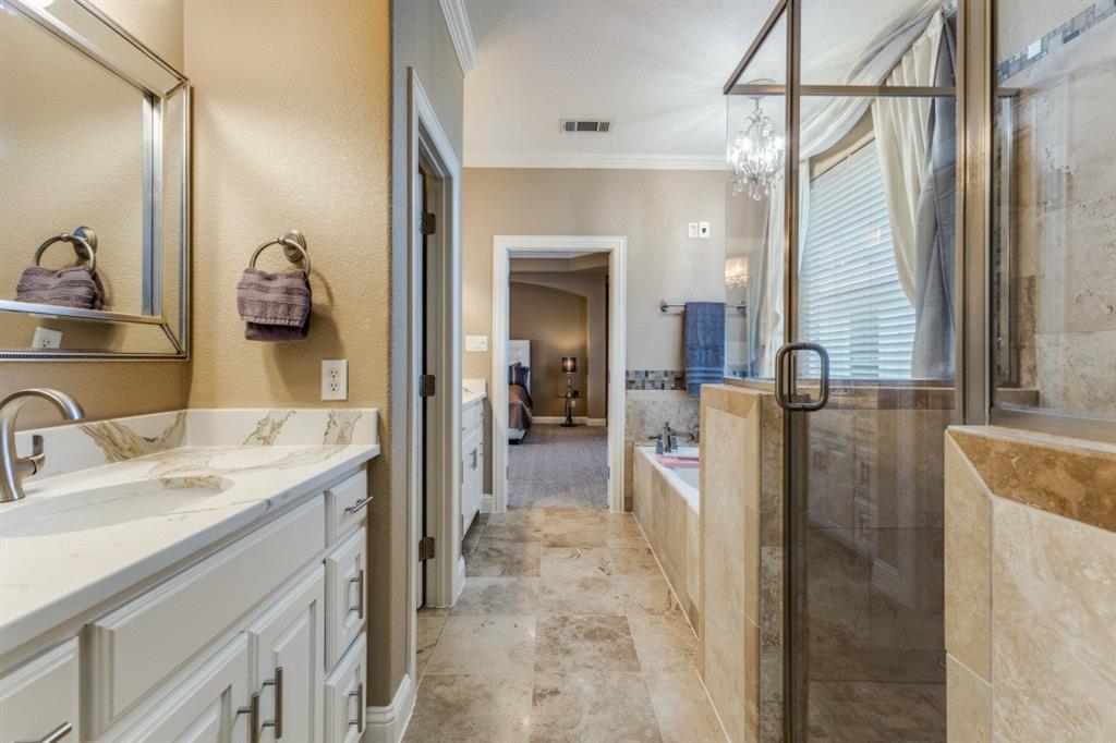 4931 Homer Street Dallas, TX 75206 - Photo 15 of 29 a bathroom with a sink vanity and mirror