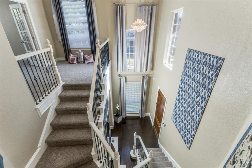 4931 Homer Street Dallas, TX 75206 - Photo 3 of 29 a view of staircase with black white walls