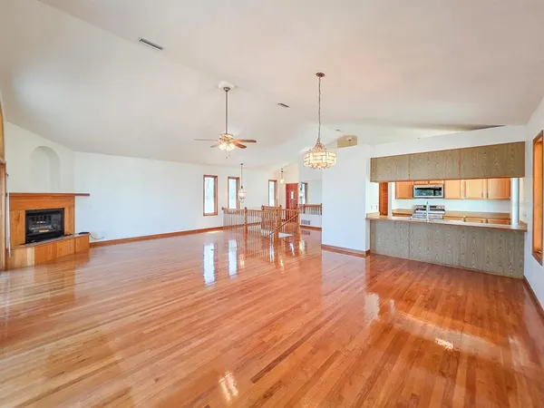 a kitchen with stainless steel appliances granite countertop a sink and cabinets