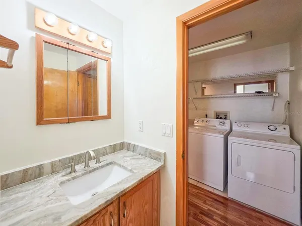 a view of a house with swimming pool and sitting area