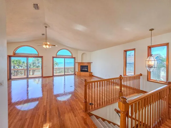 a view of a kitchen with kitchen island a counter top space and cabinets