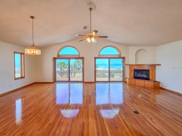 a kitchen with stainless steel appliances granite countertop a refrigerator a stove and a microwave