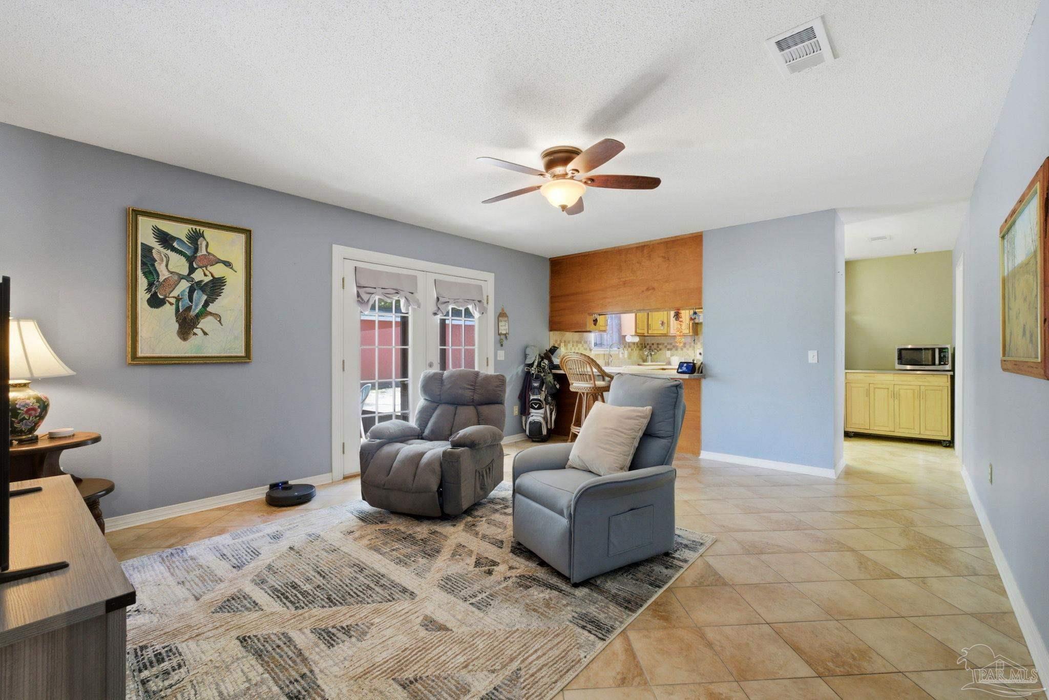 5121 Keyser Mill Road Baker, FL 32531 - Photo 23 of 52 a living room with furniture