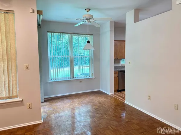 an empty room with windows and outdoor view