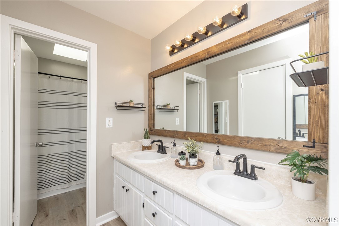 3018 3 Bridges Road Midlothian, VA 23112 - Photo 16 of 30 Full bathroom with wood finished floors, a sink, a