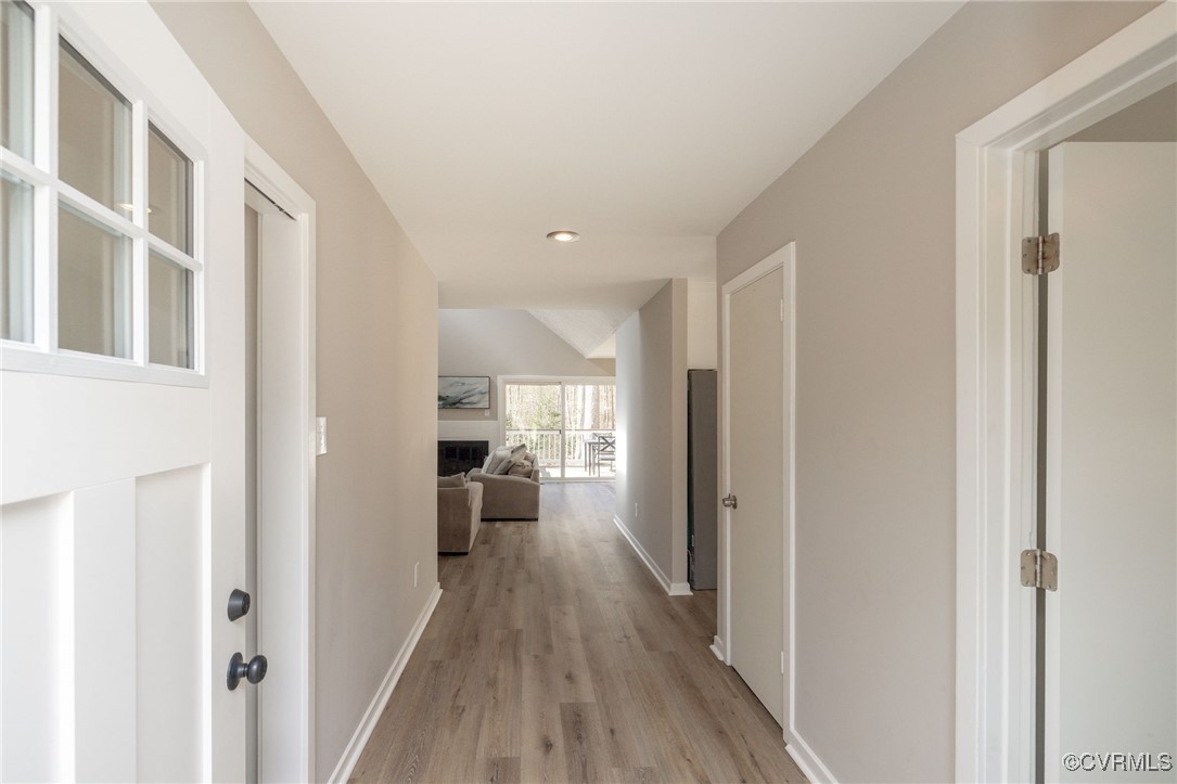 3018 3 Bridges Road Midlothian, VA 23112 - Photo 3 of 30 Hallway with light wood-type flooring and baseboar
