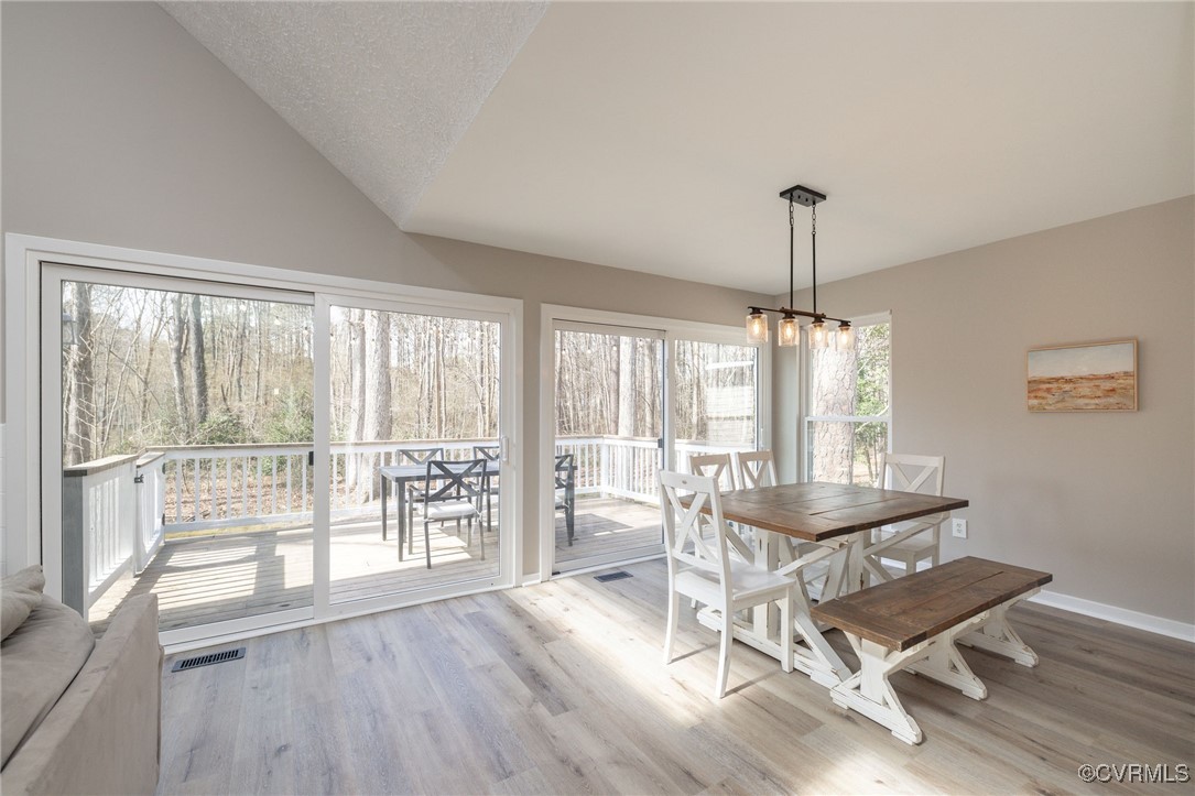 3018 3 Bridges Road Midlothian, VA 23112 - Photo 8 of 30 Dining area with vaulted ceiling, wood finished fl