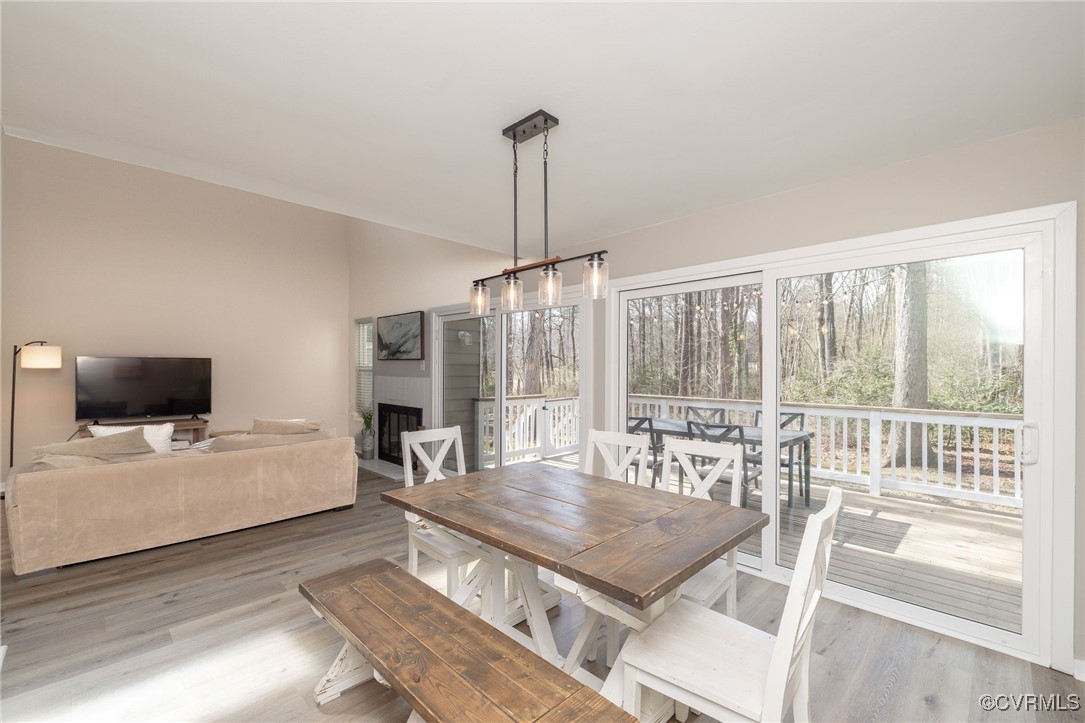3018 3 Bridges Road Midlothian, VA 23112 - Photo 9 of 30 Dining room featuring lofted ceiling, a fireplace,