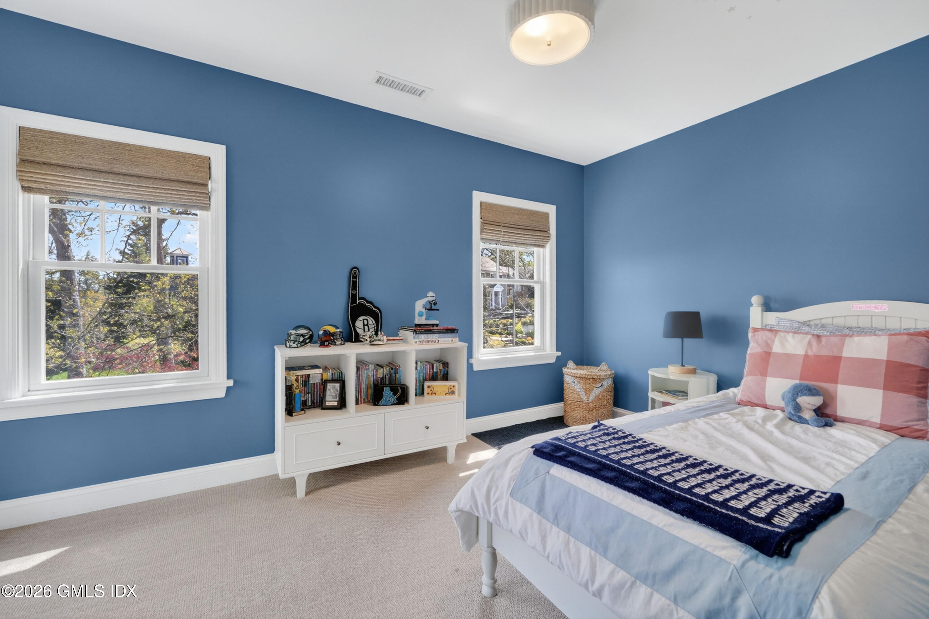 20 Ridge Road Cos Cob, CT 06807 - Photo 28 of 36 a bedroom with a large bed and a window