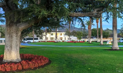 a view of a house with a backyard