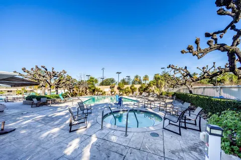 a view of a chairs and table in patio