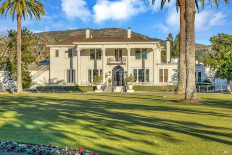 a view of a building with a yard