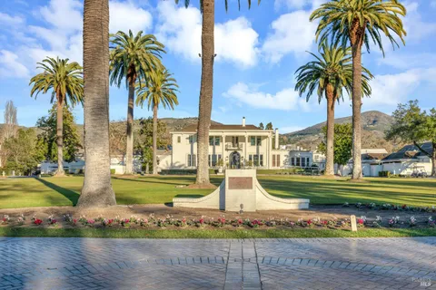 a swimming pool with outdoor seating and yard