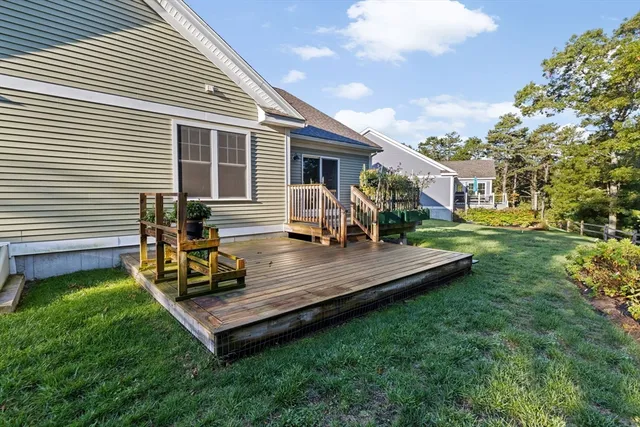 a view of a backyard with sitting area