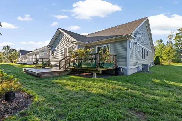 a view of a house with a yard porch and sitting area