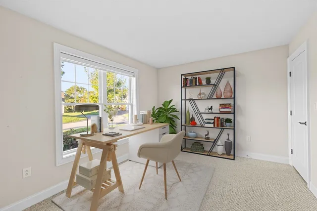 a dining room with furniture and a window