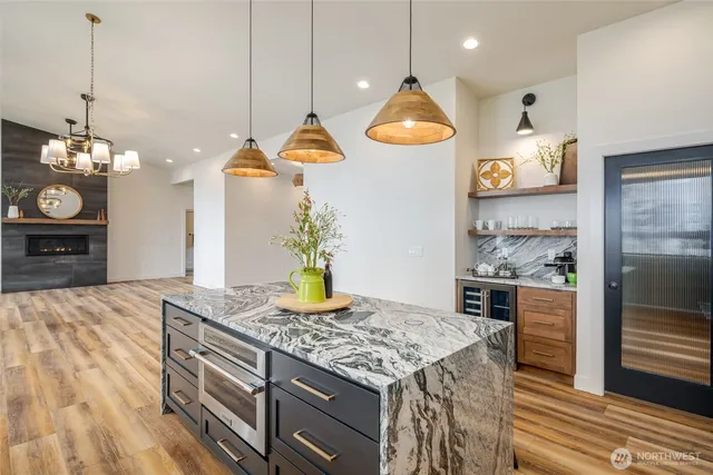 a stove top oven sitting inside of a kitchen