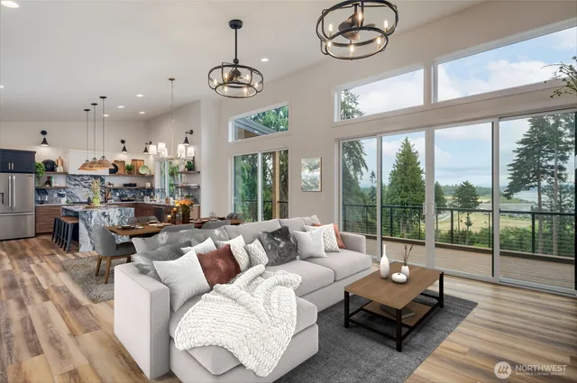 a view of a room with furniture and wooden floor