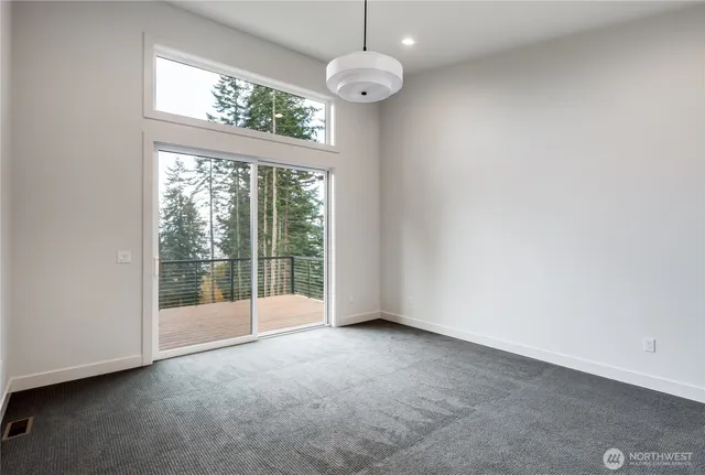 a spacious bathroom with double vanity and a mirror