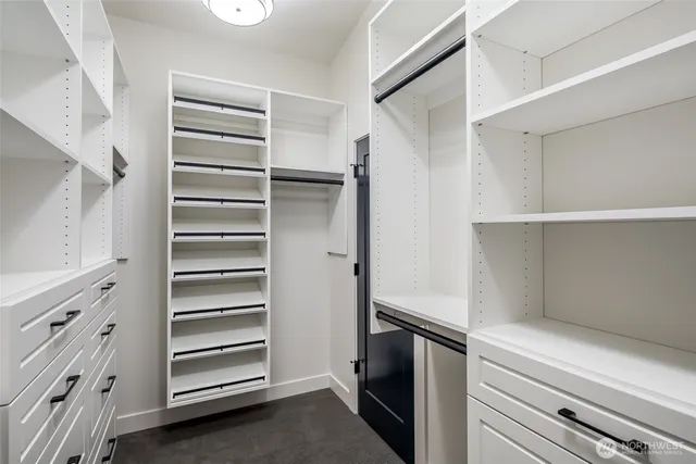 a bathroom with a double vanity sink toilet mirror and bathtub