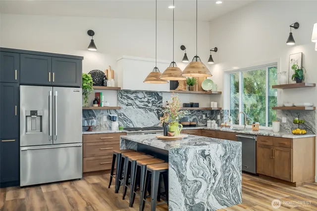 a kitchen with a sink and a large window