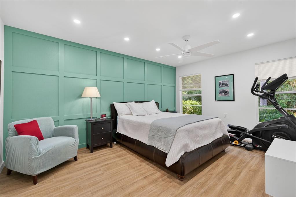 4916 Troon Lane New Port Richey, FL 34655 - Photo 11 of 53 a bed room with a bed and a couch