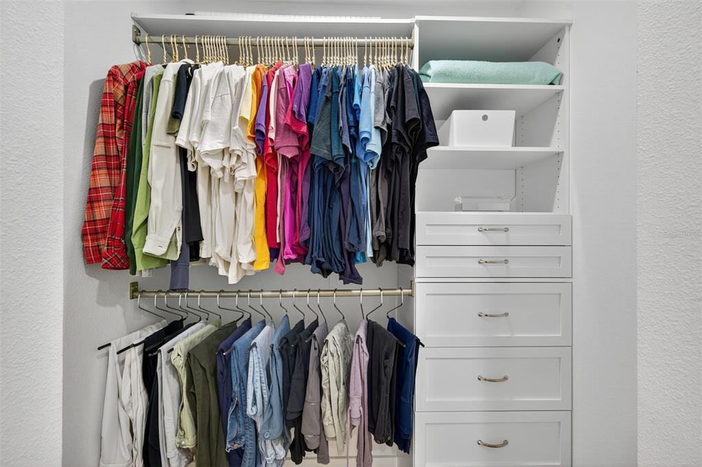 4916 Troon Lane New Port Richey, FL 34655 - Photo 16 of 53 a view of walk in closet with clothes and shoes