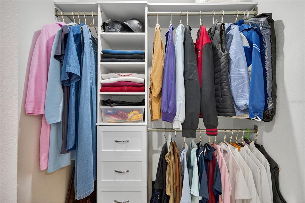 4916 Troon Lane New Port Richey, FL 34655 - Photo 17 of 53 a view of walk in closet with clothes