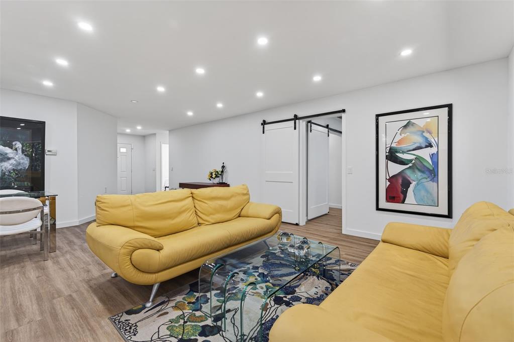 4916 Troon Lane New Port Richey, FL 34655 - Photo 19 of 53 a living room with furniture and wooden floor