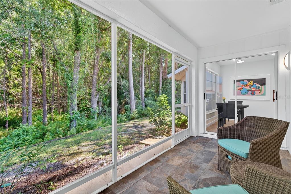 4916 Troon Lane New Port Richey, FL 34655 - Photo 2 of 53 a living room with furniture and a floor to ceiling window