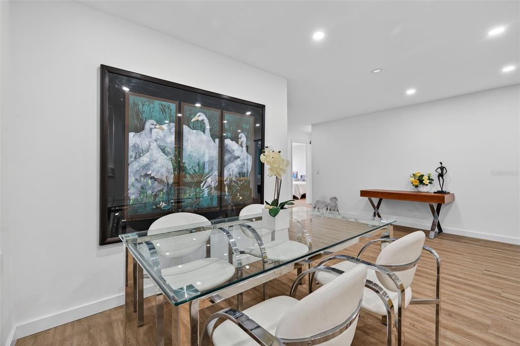 4916 Troon Lane New Port Richey, FL 34655 - Photo 21 of 53 a table and chairs in a room