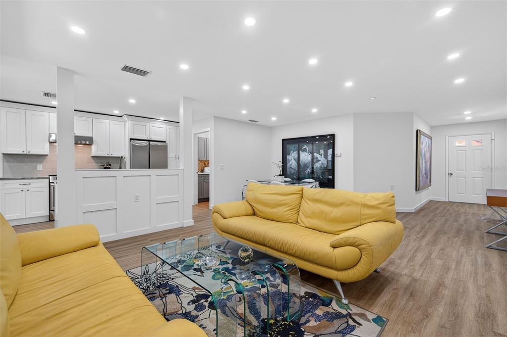 4916 Troon Lane New Port Richey, FL 34655 - Photo 24 of 53 a living room with furniture and kitchen view