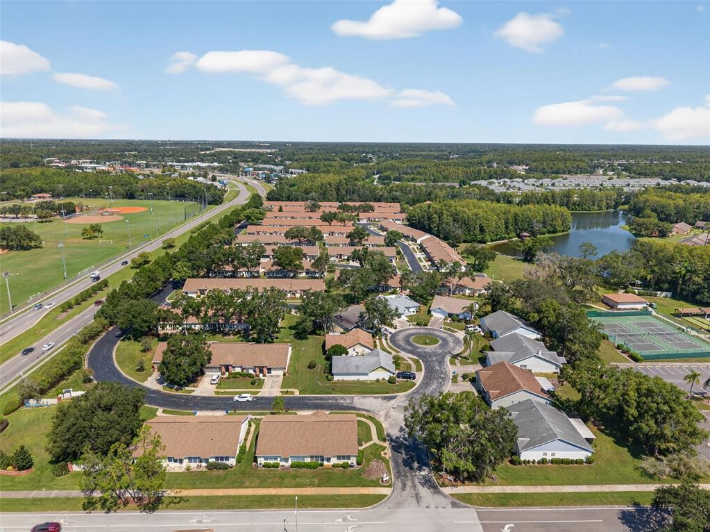 4916 Troon Lane New Port Richey, FL 34655 - Photo 43 of 53 an aerial view of residential building and lake