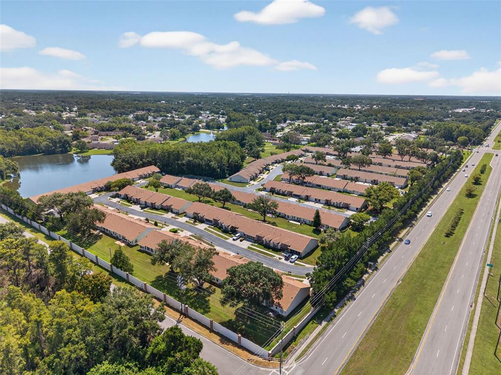 4916 Troon Lane New Port Richey, FL 34655 - Photo 44 of 53 an aerial view of residential houses with outdoor space and river