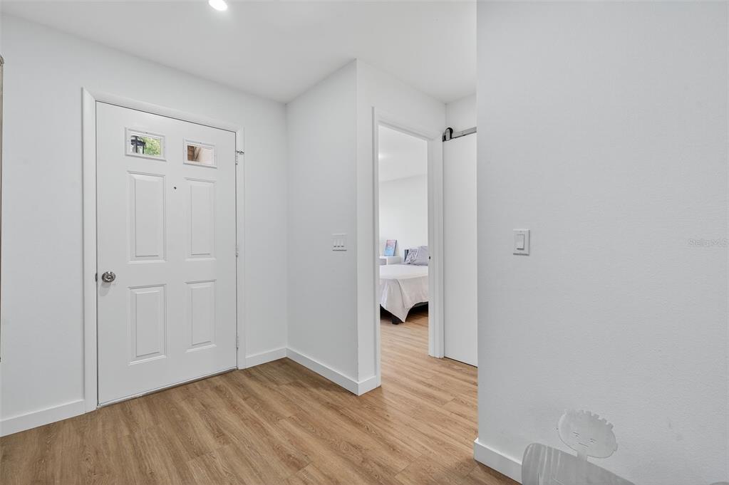 4916 Troon Lane New Port Richey, FL 34655 - Photo 7 of 53 wooden floor in an empty room