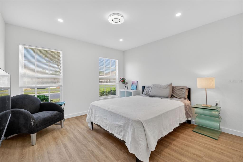 4916 Troon Lane New Port Richey, FL 34655 - Photo 8 of 53 a bedroom with a bed and a couch