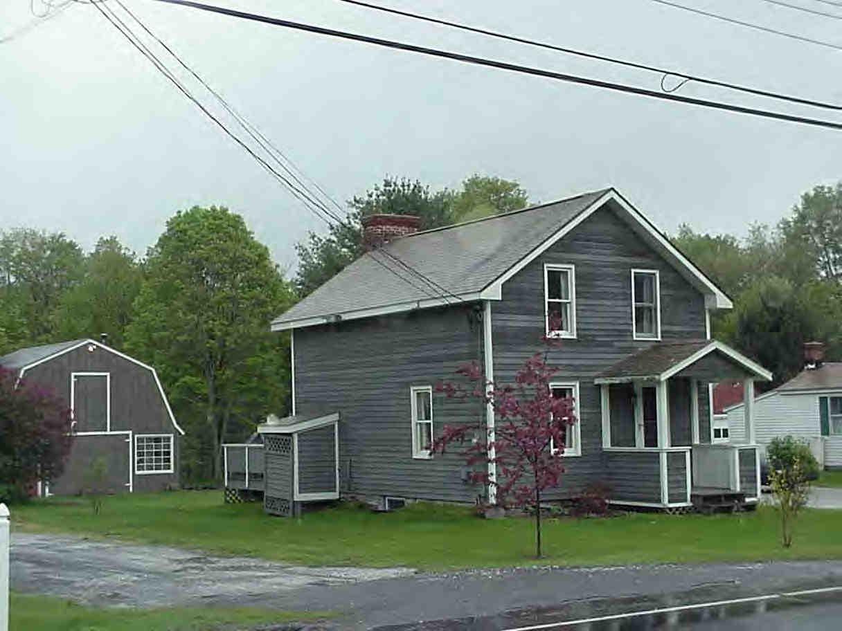 2785 State Road Richmond, MA 01254 - Photo 1 of 5 a front view of a house with a garden
