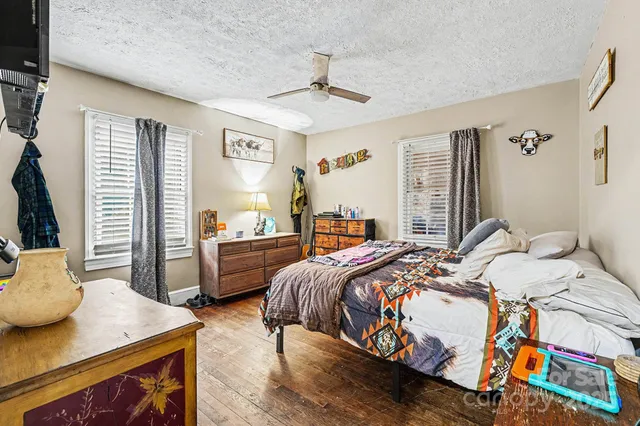 a bed room with a bed and a table