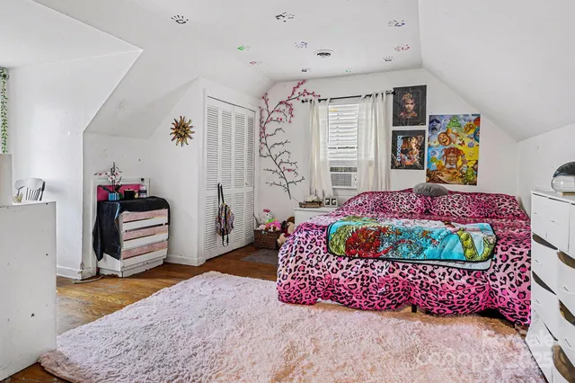 a view of a livingroom with furniture and entryway wooden floor