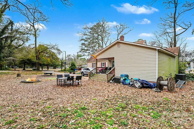 a view of house with trees in the background