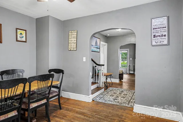 a view of a livingroom with furniture and entryway