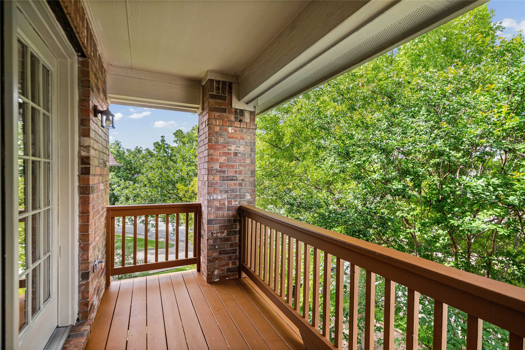 10700 Pointe View Drive Austin, TX 78738 - Photo 21 of 35 A private, covered balcony offers treetop views, ideal for serene outdoor relaxation.