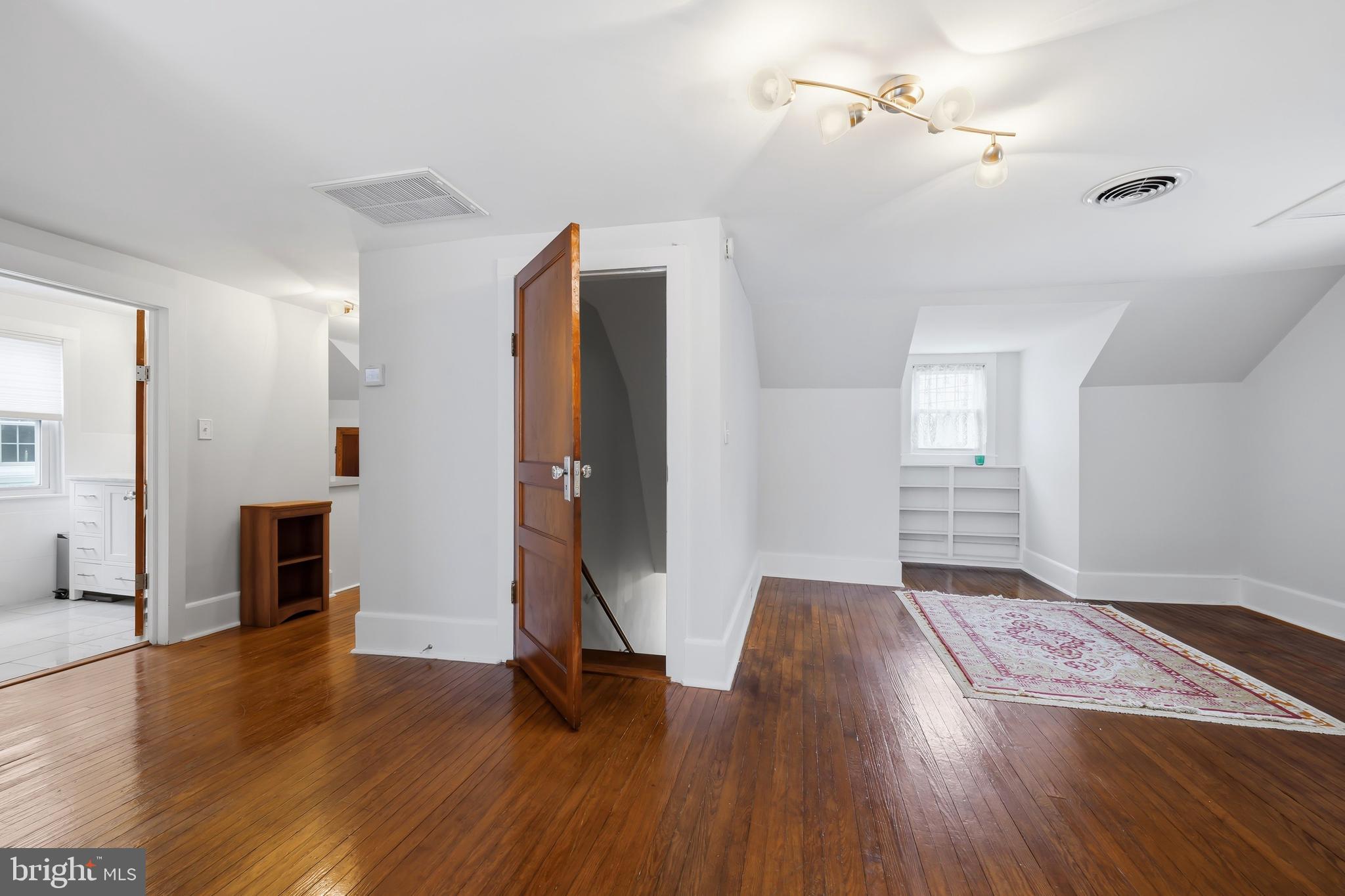 207 Crusader Road Cambridge, MD 21613 - Photo 50 of 76 a view of empty room with a fireplace and wooden floor