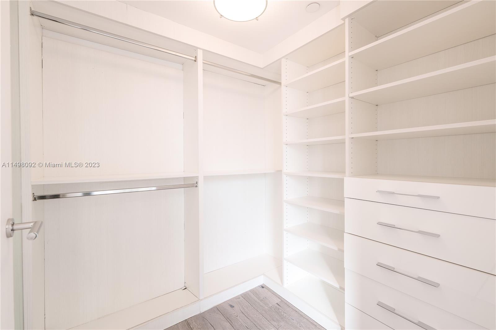 9501 Collins Avenue, Unit 1 Surfside, FL 33154 - Photo 15 of 35 a view of an empty walk in closet