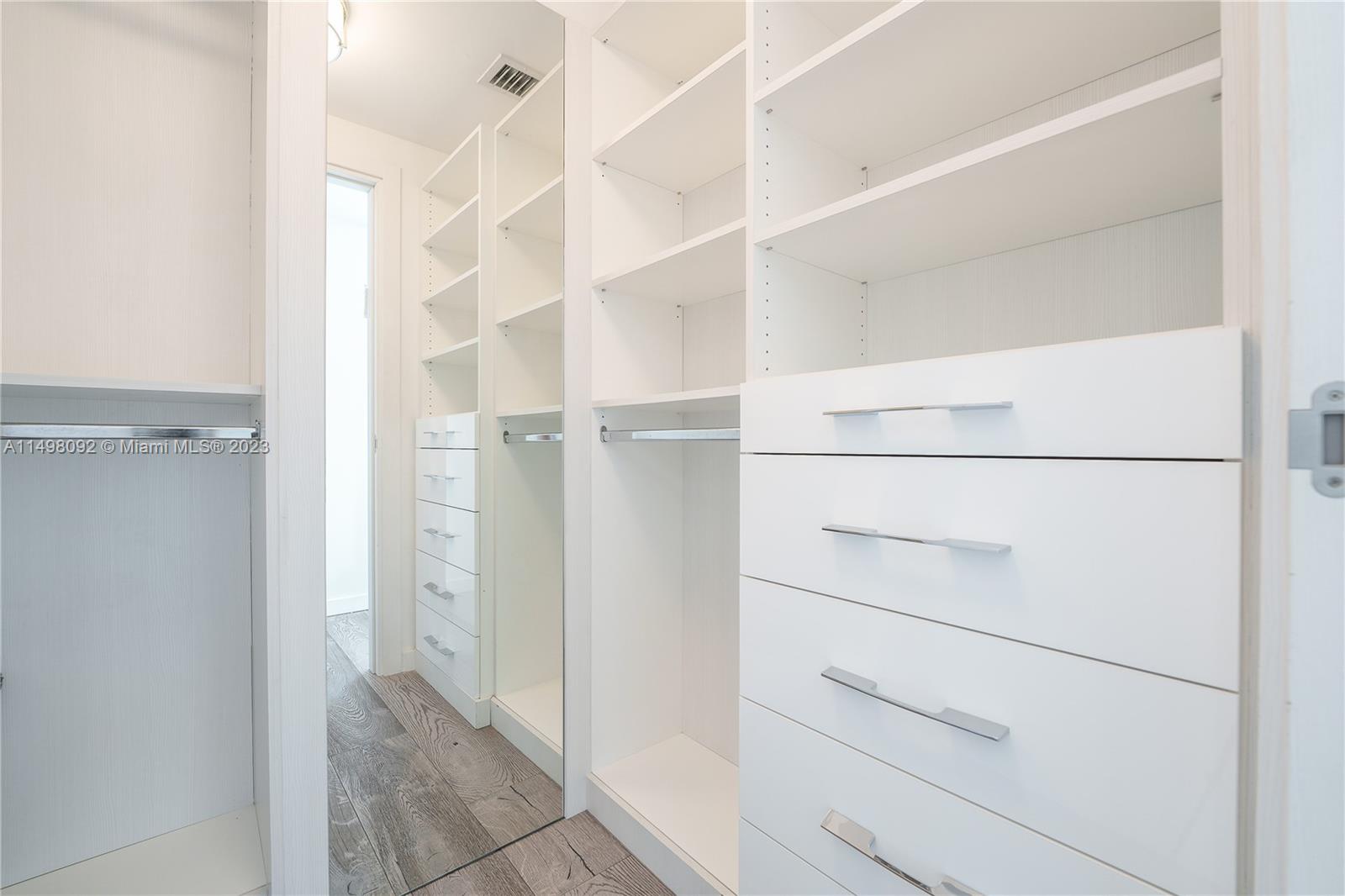 9501 Collins Avenue, Unit 1 Surfside, FL 33154 - Photo 20 of 35 a view of walk in closet