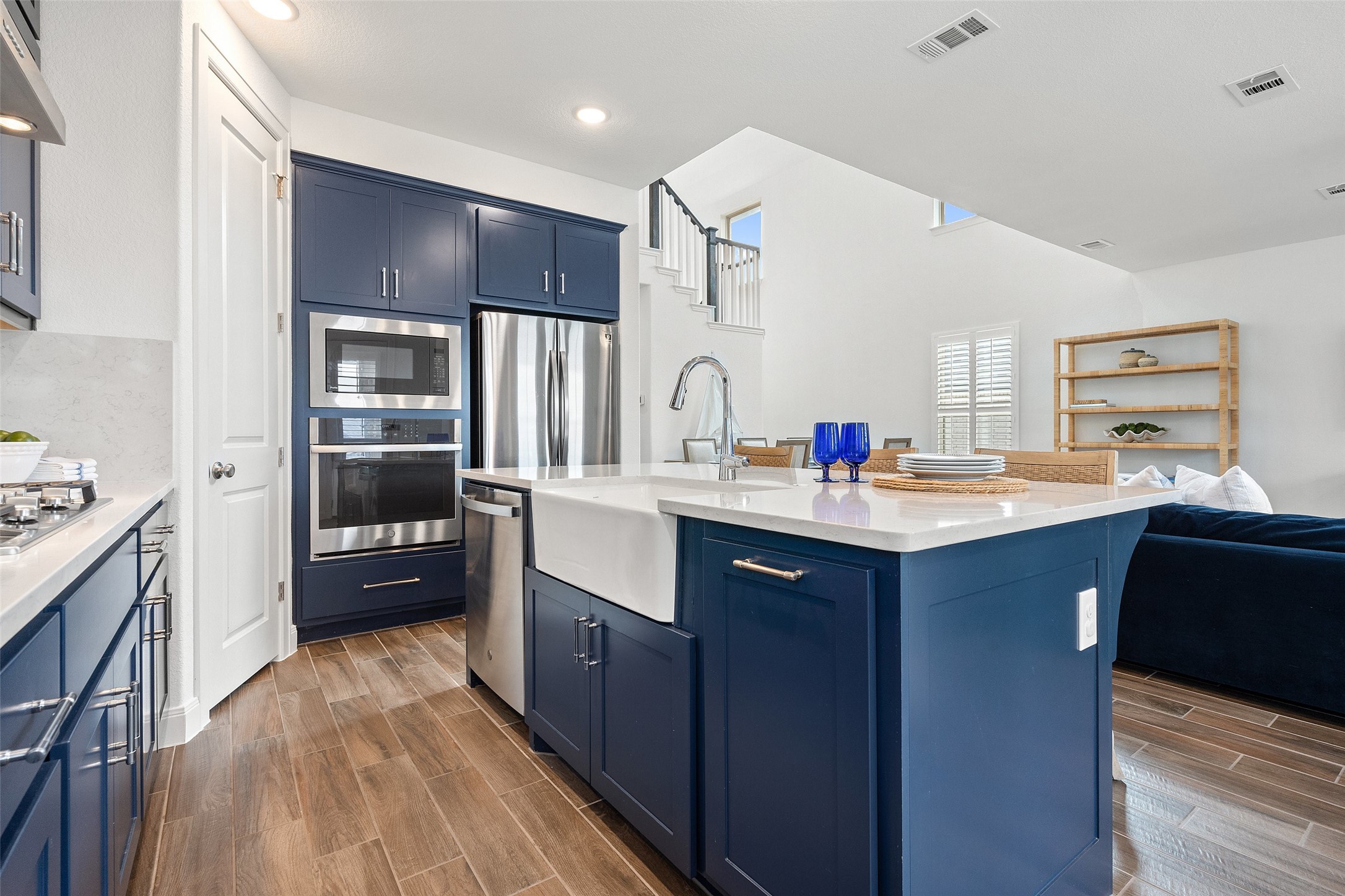 604 Pecan Bottom Trail Georgetown, TX 78628 - Photo 40 of 40 a kitchen with granite countertop a sink stove and refrigerator