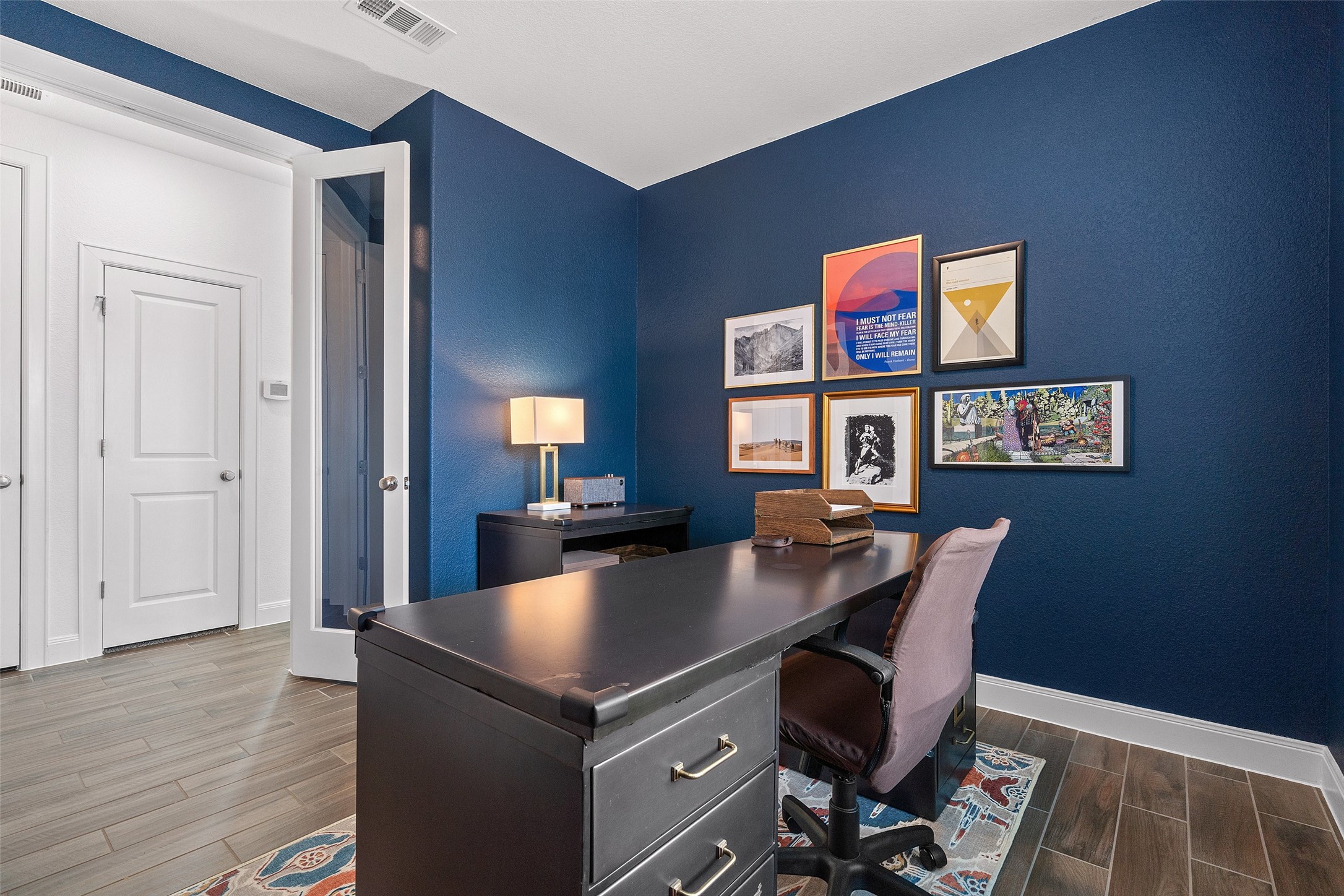 604 Pecan Bottom Trail Georgetown, TX 78628 - Photo 16 of 40 a view of a workspace with furniture and a window
