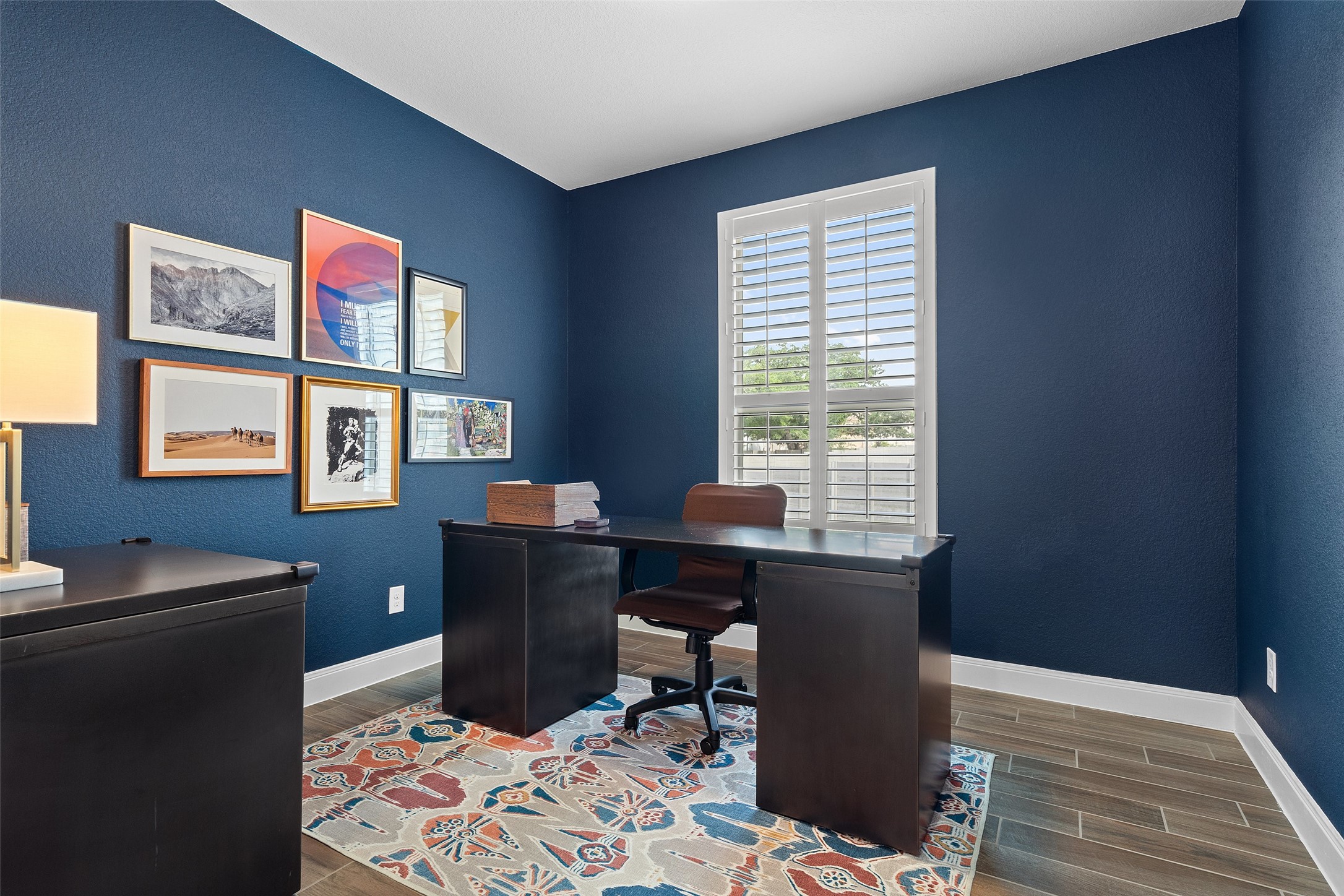 604 Pecan Bottom Trail Georgetown, TX 78628 - Photo 17 of 40 a view of a workspace with furniture and a window