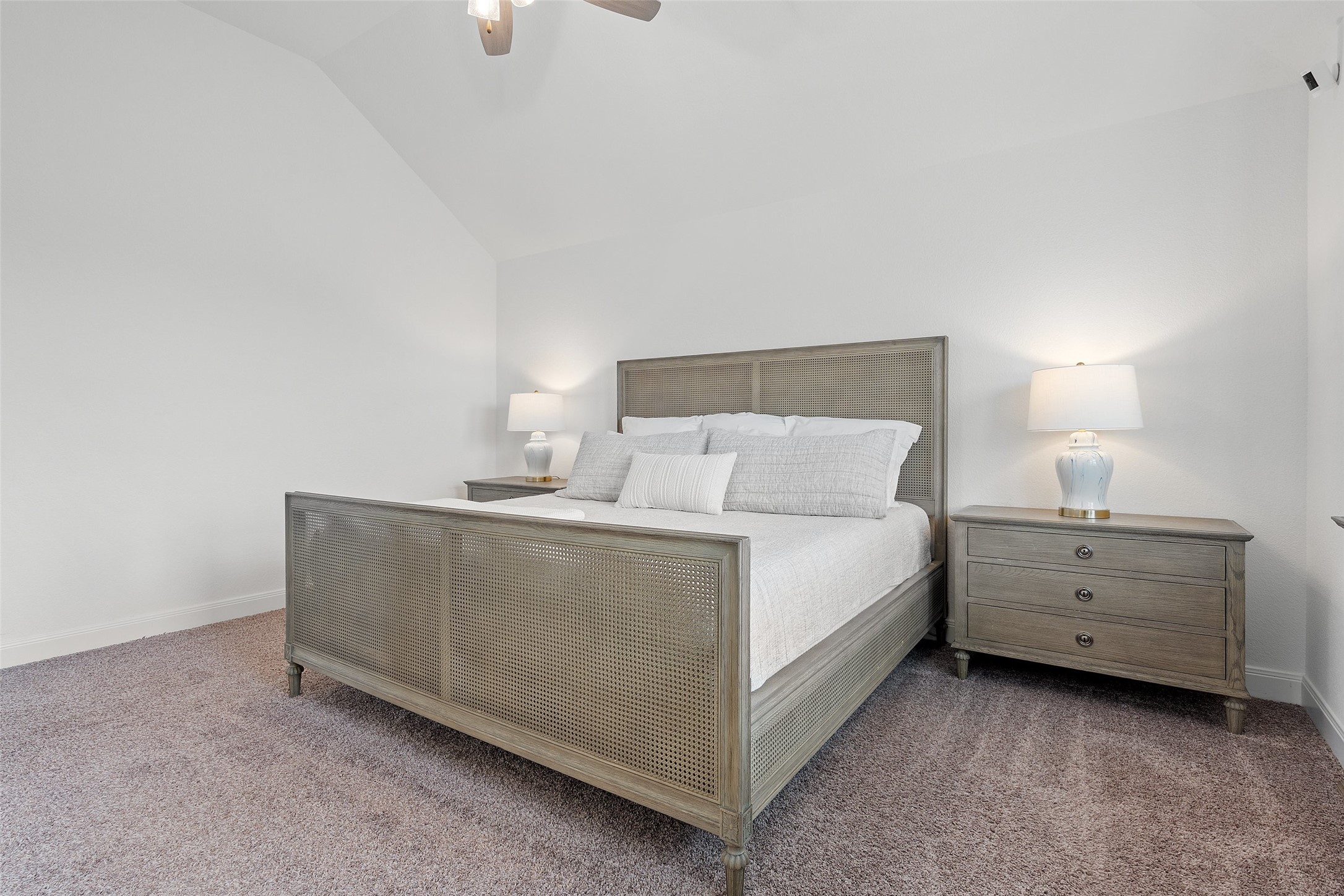 604 Pecan Bottom Trail Georgetown, TX 78628 - Photo 19 of 40 Bedroom with carpet flooring, vaulted ceiling, and ceiling fan