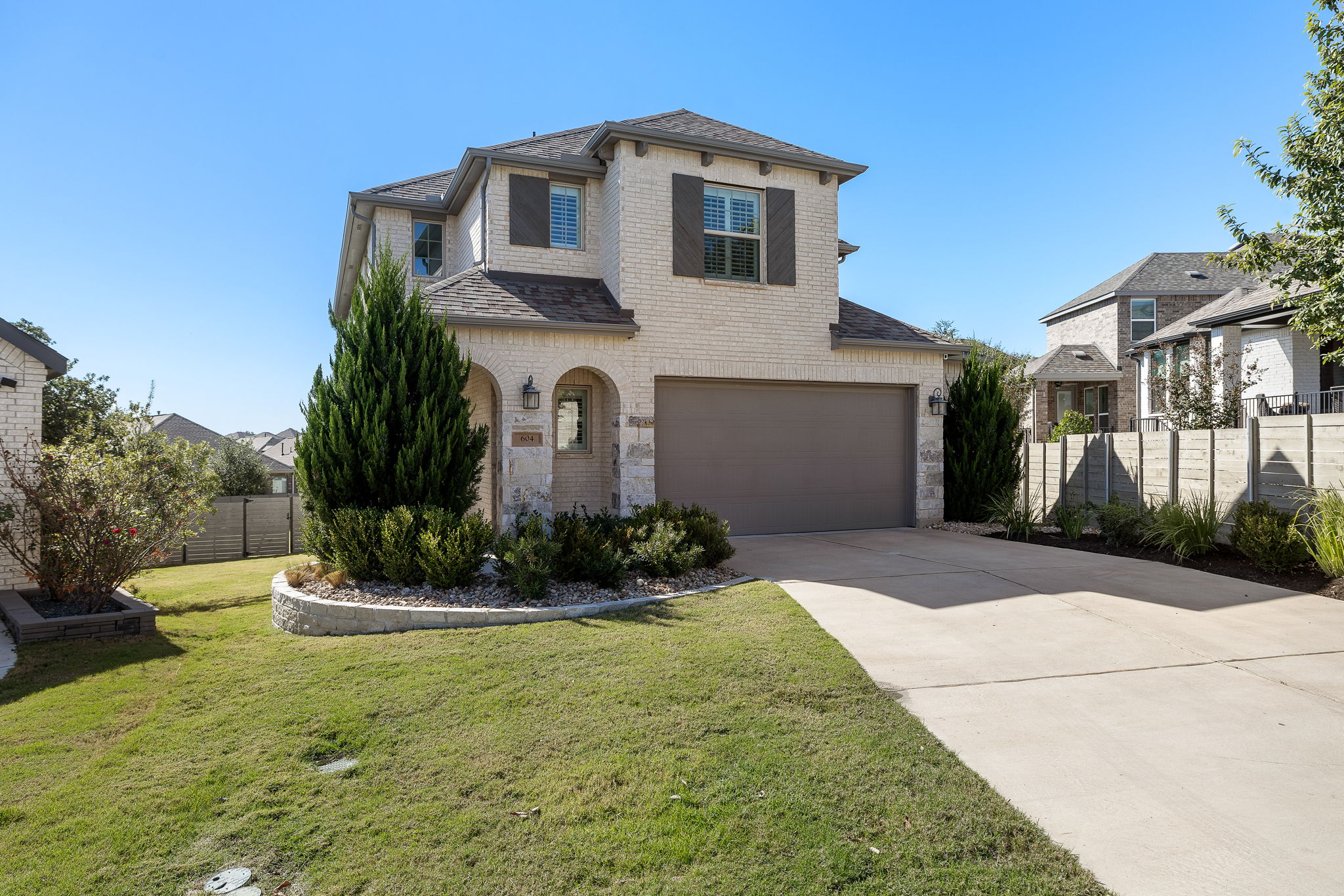 604 Pecan Bottom Trail Georgetown, TX 78628 - Photo 2 of 40 a front view of a house with a yard